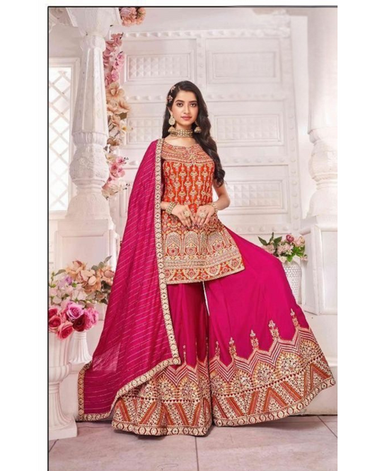 Red sharara set with intricate embroidery for a royal festive look.